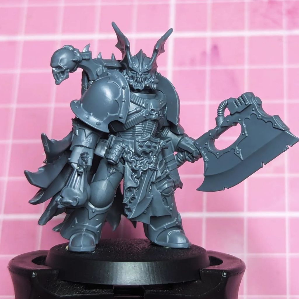 Master of Excecutions Night Lords Kill Team Head Hunter Headsman with Axe of Dismemberment or Headsman Axe carrying trophies decapitated from his enemies and the flayer skins of his victims