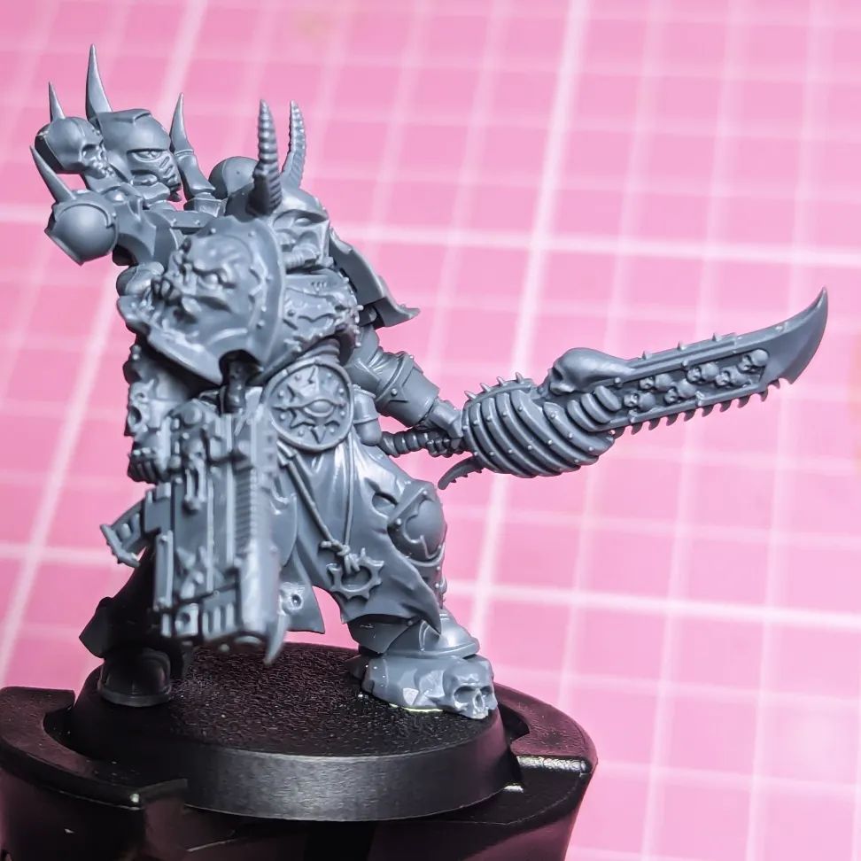 Night Lords Chainsword used on an Emperors Children Chosen Champion also carrying a converted Combi-plasma. Both are excessive and Slaanesh would approve 