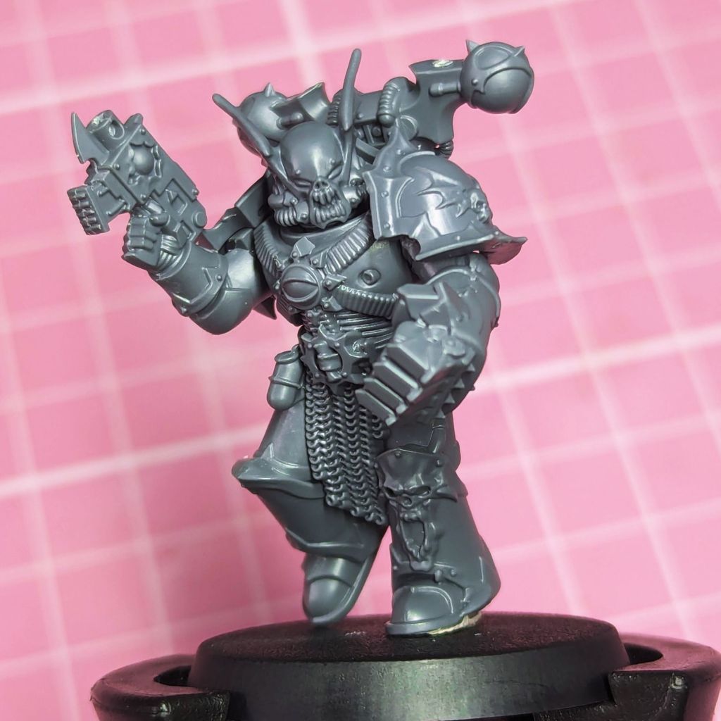 Night Lords Terror Squad Member made from the Nemesis Claw Kill Team kit. This Night Lord has a Power Fist or Heavy Melee Weapon